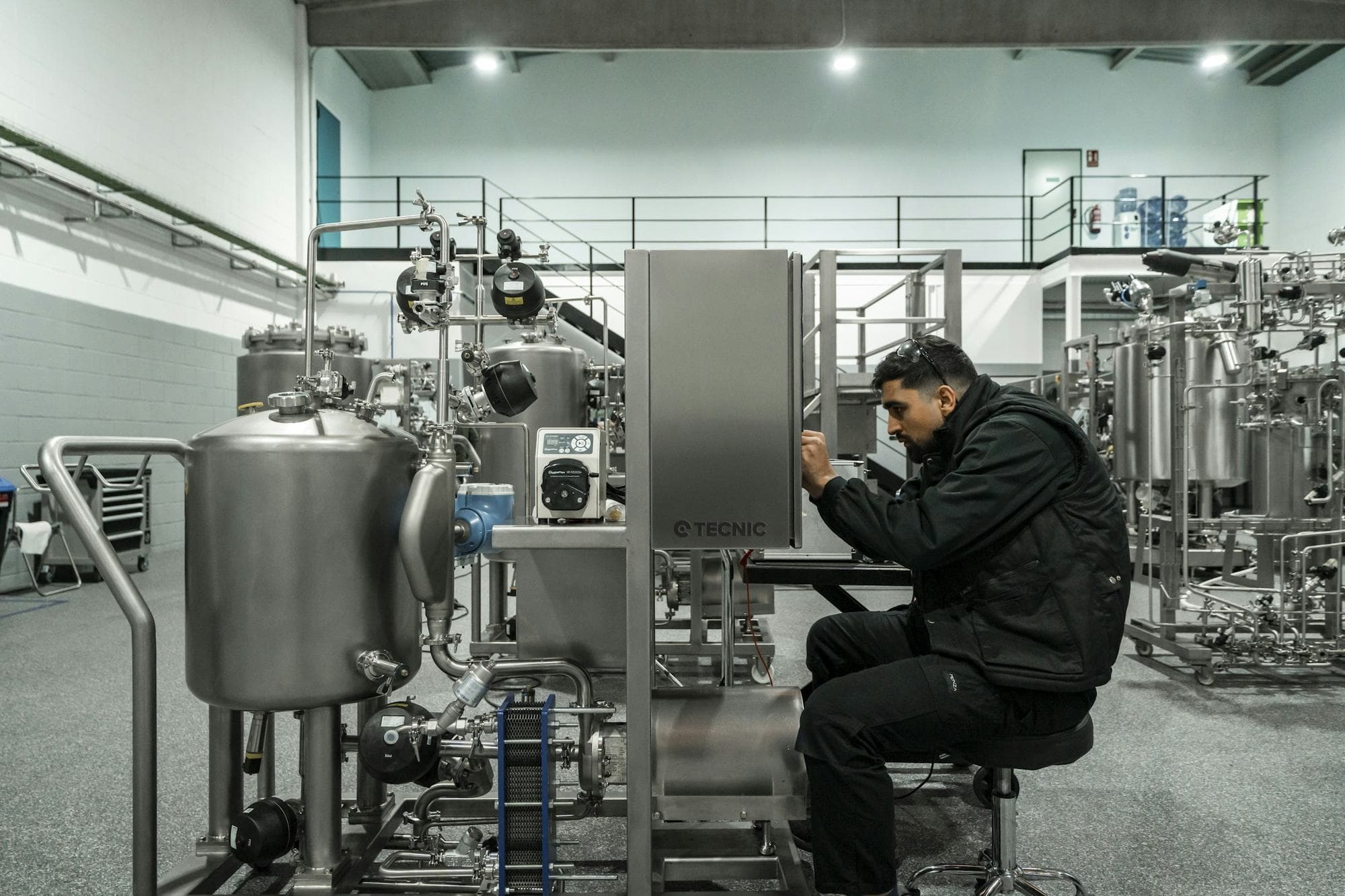 Technician diagnosing a fault on process machinery