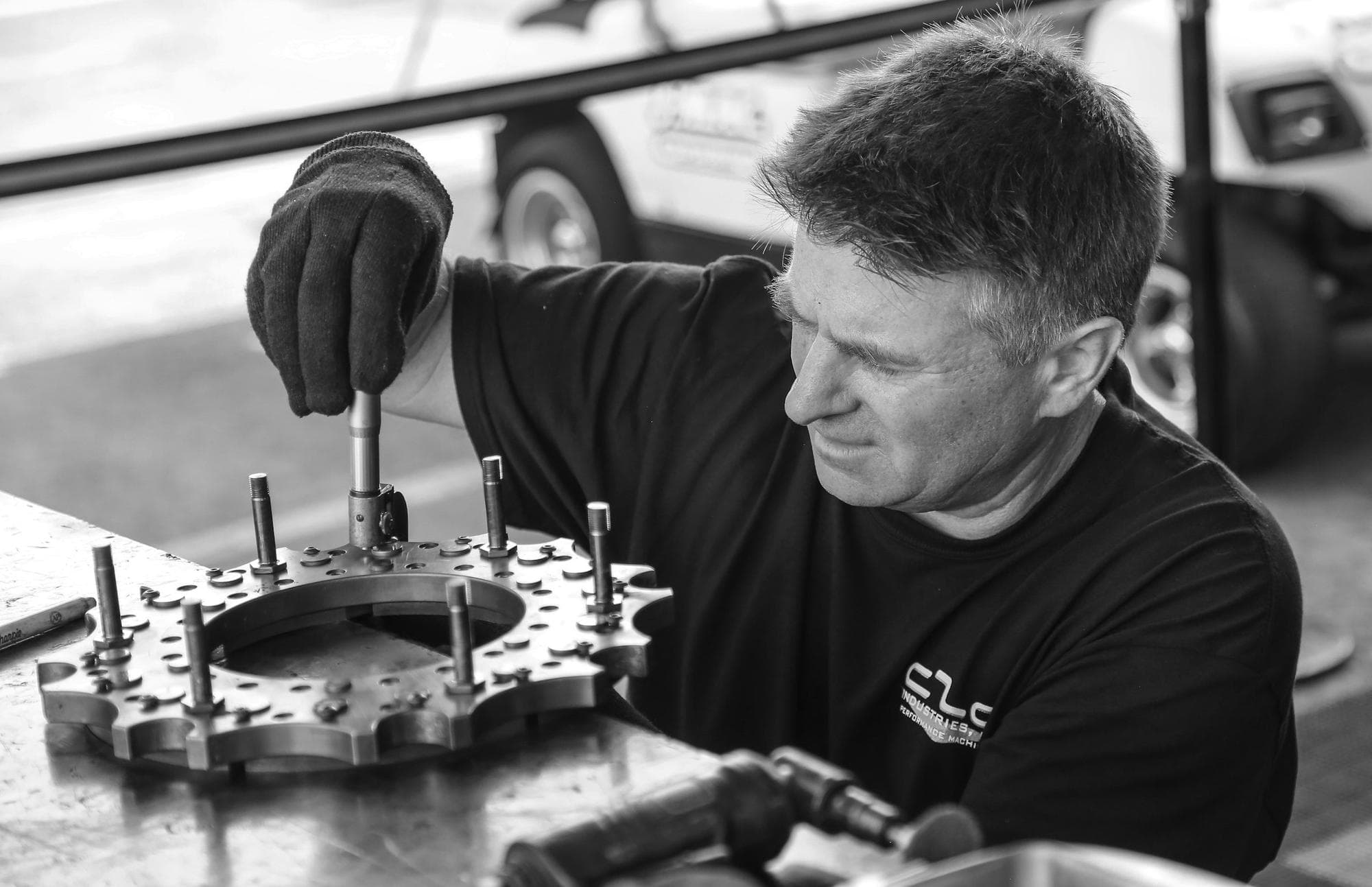 Technician servicing a machine gear