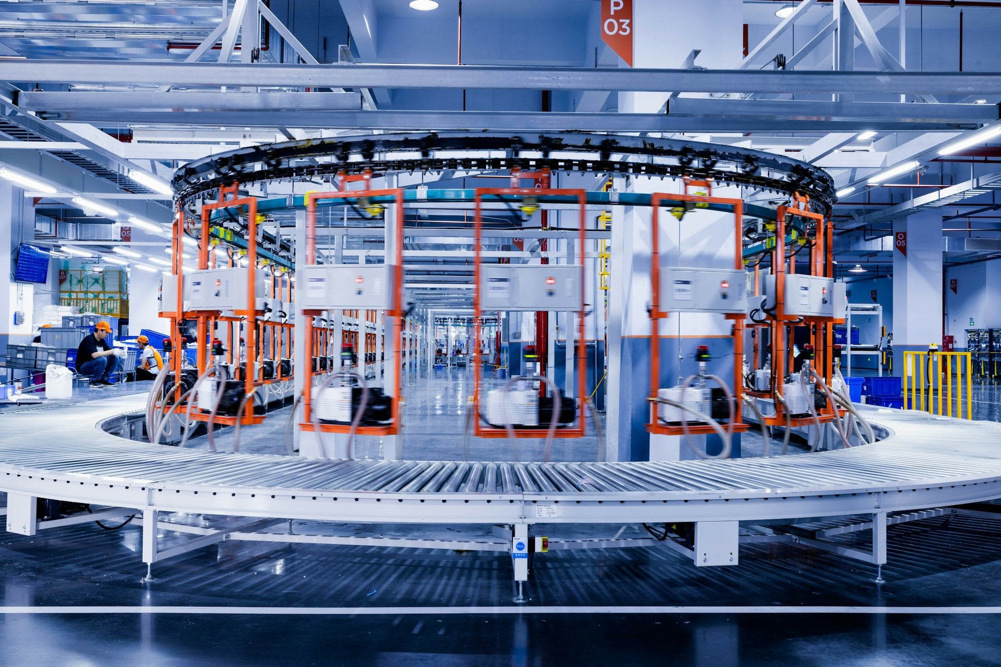 Team working on the installation of a large production machine