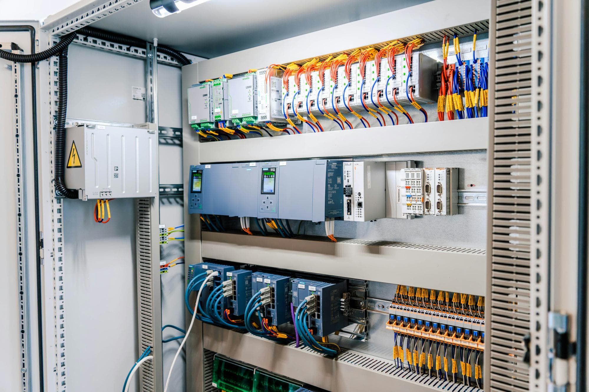 Industrial control cabinet with PLC and drive modules
